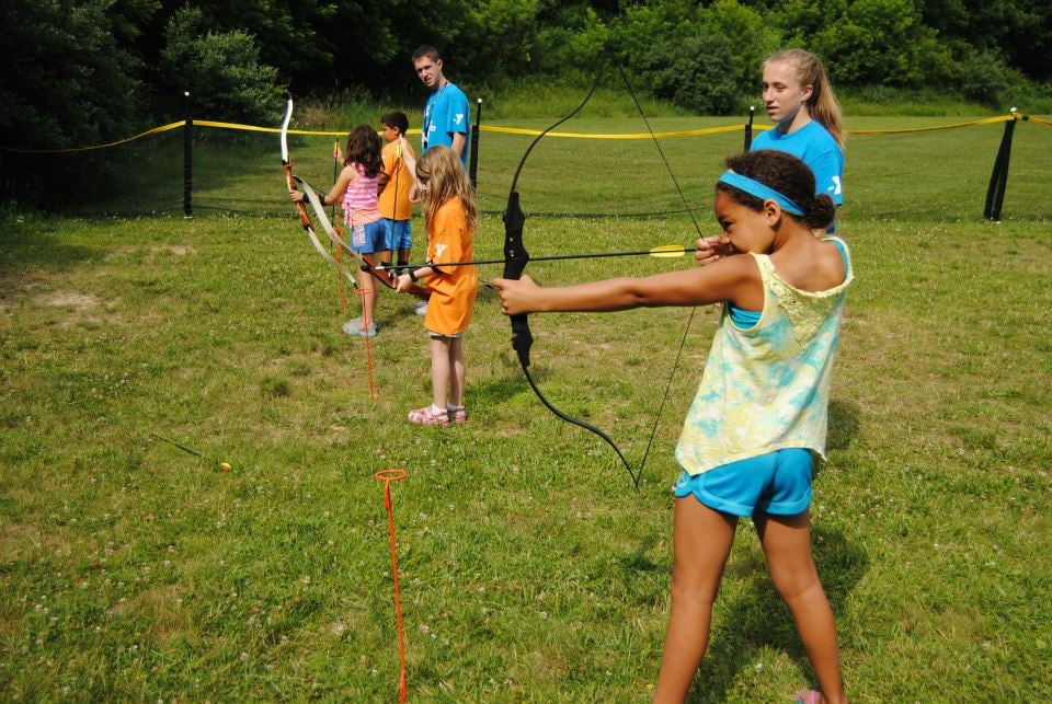 Kids learning archery Kids playing at Sussex County YMCA summer day camp