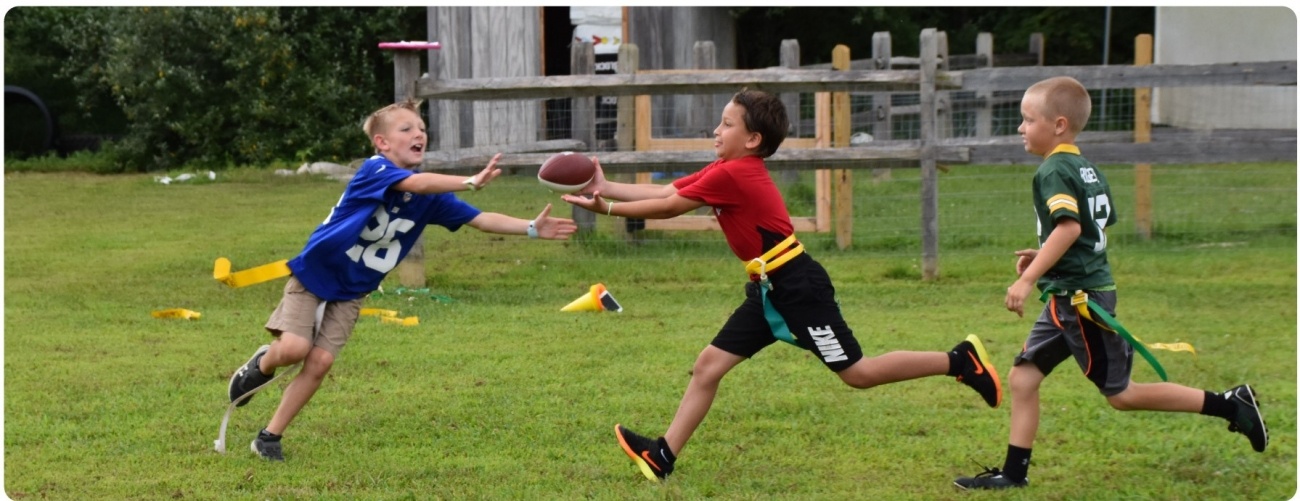 Kids playing flag football Kids playing at Sussex County YMCA summer sports camp